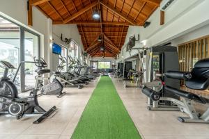 a gym with treadmills and cardio machines at Ama Villas - Luxury Private Villas in Mont-Choisy Beach in Mont Choisy