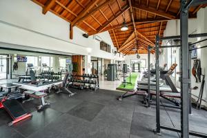 a gym with a lot of treadmills and machines at Ama Villas - Luxury Private Villas in Mont-Choisy Beach in Mont Choisy