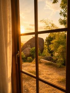 a window looking out at a view of an elephant at Reen Run Sunset Private Pool Villa in Ko Phangan +26 photos