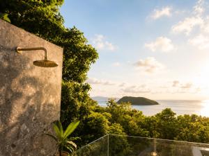 a bathroom with a view of the ocean at Reen Run Sunset Private Pool Villa in Ko Phangan