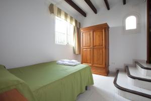 En eller flere senge i et værelse på Sunway Torre La Veleta