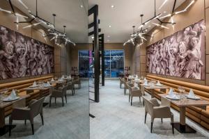 A restaurant or other place to eat at Delphin BE Grand Resort