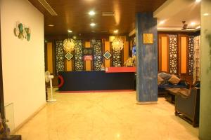 a lobby of a store with a counter in the middle at Hotel Sree7 Inn in George Town