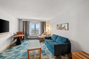 a living room with a couch and a tv at Hampton Inn Duluth-Canal Park in Duluth