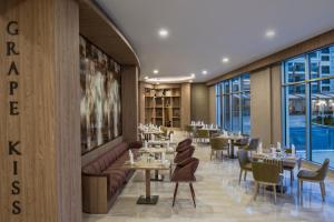 A restaurant or other place to eat at Delphin BE Grand Resort