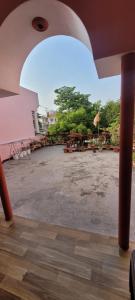 an empty parking lot with trees in the background at Casa Aura in Lucknow
