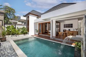 an image of a swimming pool in a villa at The Prime Seminyak by Kanaya Hospitality in Seminyak