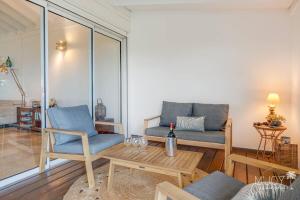a living room with a couch and a table at Villa Stella in Saint-Leu +20 photos