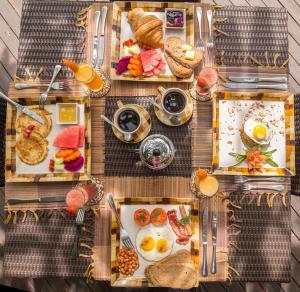 an overhead view of a table of breakfast foods at Villa Seriska Dua Sanur with Private Pool in Sanur