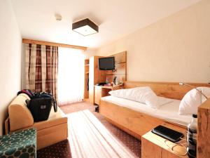 TV a/nebo společenská místnost v ubytování Hotel Röck Garni