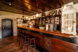 a bar with bar stools in a room with at Ferienhaus Lemmerheide in Rüthen