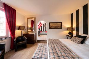 a bedroom with a bed and a room with a mirror at Ferienhaus Lemmerheide in Rüthen