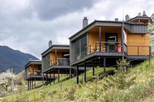 a house on the side of a hill at Krasnyk Resort in Verkhovyna