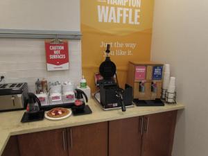 a kitchen counter with a coffee maker and a coffeeaffle at Hampton Inn Summersville in Summersville