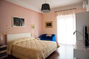 Un pat sau paturi într-o cameră la Alma b&b