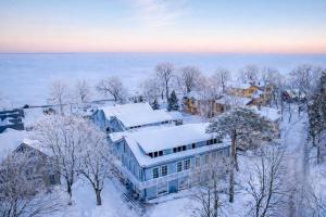 an aerial view of a town covered in snow at Marių vilos apartamentai Balcony with a Lagoon View in Juodkrantė