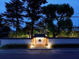 a house with a door with lights at night at 翠門亭 in Nara +24 photos