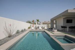 a swimming pool in the backyard of a house at Mercury @ Elemento49 - Pool Spa - Sleeps 16 in Indio