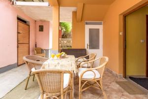 a dining room with a table and chairs at Dina Apartments in Pula