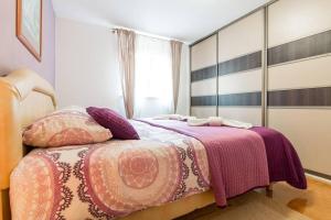 Cama ou camas em um quarto em Dina Apartments