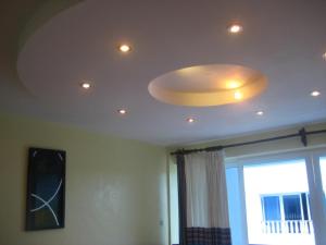 a ceiling with a large light fixture on it at Sunny Beachfront Studio in Mombasa