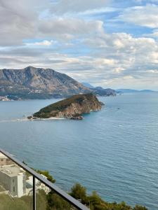 an island in the middle of a body of water at Panoramic Sea View in Budva