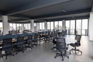 a large room with tables and chairs and windows at Sky Luxury Residence, 12th Floor, Panoramic in Guadalajara +49 photos