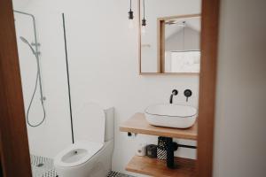 a bathroom with a sink and a toilet at View Street Studios - Tallerack in Albany
