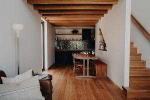 a living room with a staircase and a table at View Street Studios - Tallerack in Albany