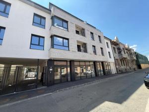 an empty street in front of a building at Aria & Boris Apart Kogalniceanu in Oradea