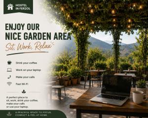 a flyer for a nice garden area with a laptop on a table at Hostel In Ferzol in Zahlé
