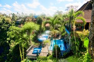 an aerial view of a resort with a swimming pool at Villa Kalisat Resort in Ubud