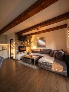 a living room with a couch and a table at Iskrin breg in Ribnica