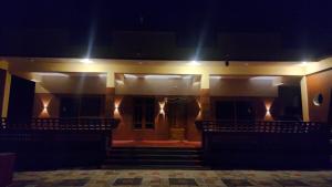 an empty auditorium with lights on the side of a building at Sri Skandaa in Sringeri