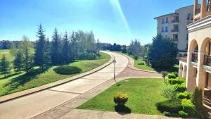 a view of a road next to a building at Luxury Lighthouse Golf Apartment in Balchik