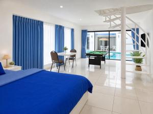 a bedroom with a bed and a pool table at Monalisa Blue haven pool hotel in Pattaya South