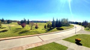 an overhead view of a road with trees and grass at Luxury Lighthouse Golf Apartment in Balchik