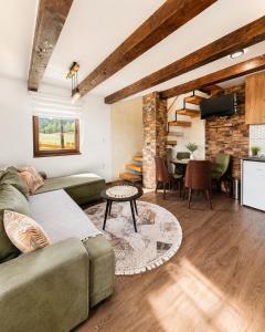 a living room with a couch and a table at Iskrin breg in Ribnica