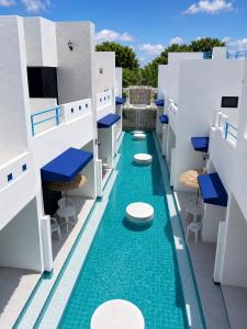 a swimming pool with toilets on the roof of a building at Monalisa Blue haven pool hotel in Pattaya South