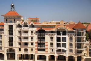 a large building with a clock tower on top of it at Residhome Arcachon Plazza in Arcachon