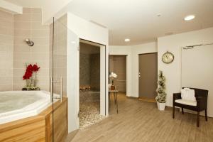 a bathroom with a large sink and a shower at Residhome Arcachon Plazza in Arcachon