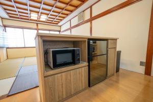 a room with a small tv in a building at yutori-nozawa in Nozawa Onsen