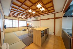 a kitchen with a table and chairs in a room at yutori-nozawa in Nozawa Onsen