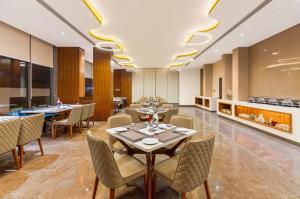 a dining room with tables and chairs at Paradise Bliss Udaipur - Luxury Boutique Hotel in Udaipur