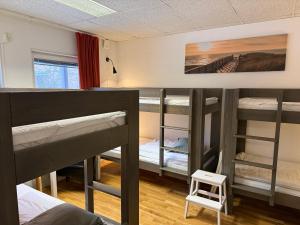 a group of bunk beds in a room at Hostel Snoozemore in Gothenburg