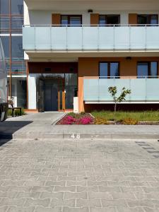 a building with a walkway in front of it at Apartament Tosia in Chełm