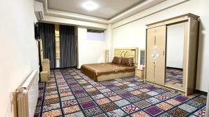 a hotel room with a bed and a tiled floor at Gulbahar Residences in Kabul