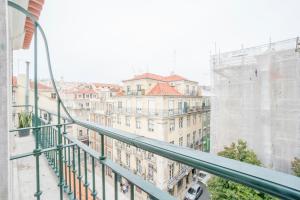 a view of a city from a balcony at Vistas de Lisboa Hostel in Lisbon