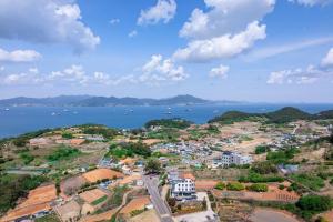 an aerial view of a town and the ocean at Yeosu Little Forest Pension in Yeosu +9 photos