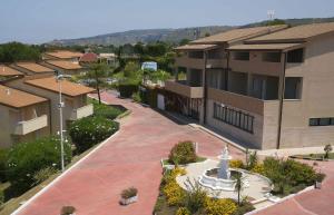 an overhead view of a building with a fountain at Club Residence Tropea Pace in Tropea